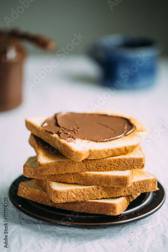 Slices of bread with chocolate cream. Close up.