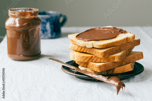 Slices of bread with chocolate cream. Close up.