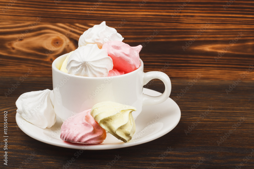 Cup with light pink meringues Cup with light pink meringues