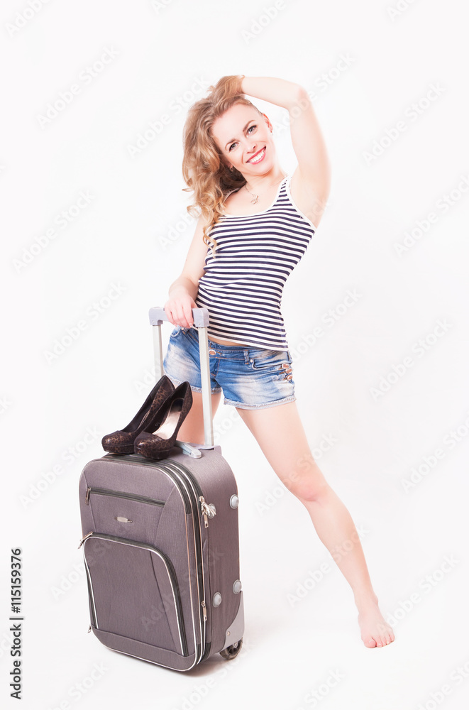Cute beautiful young woman with a suitcase Cute beautiful young woman with a suitcase