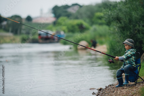 Fotografia, Obraz boy fishing on the coast of river