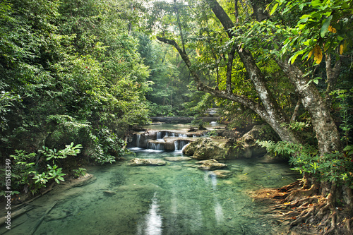 waterfall in  deep forest on mountain