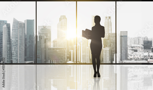 silhouette of business woman with folders