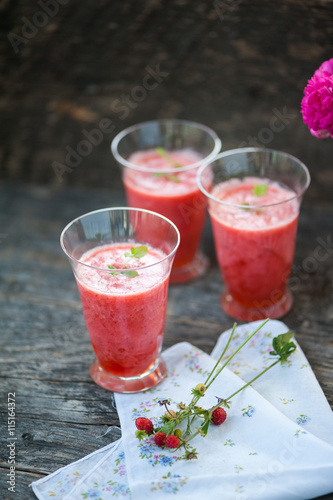 Watermelon juice on a wooden table