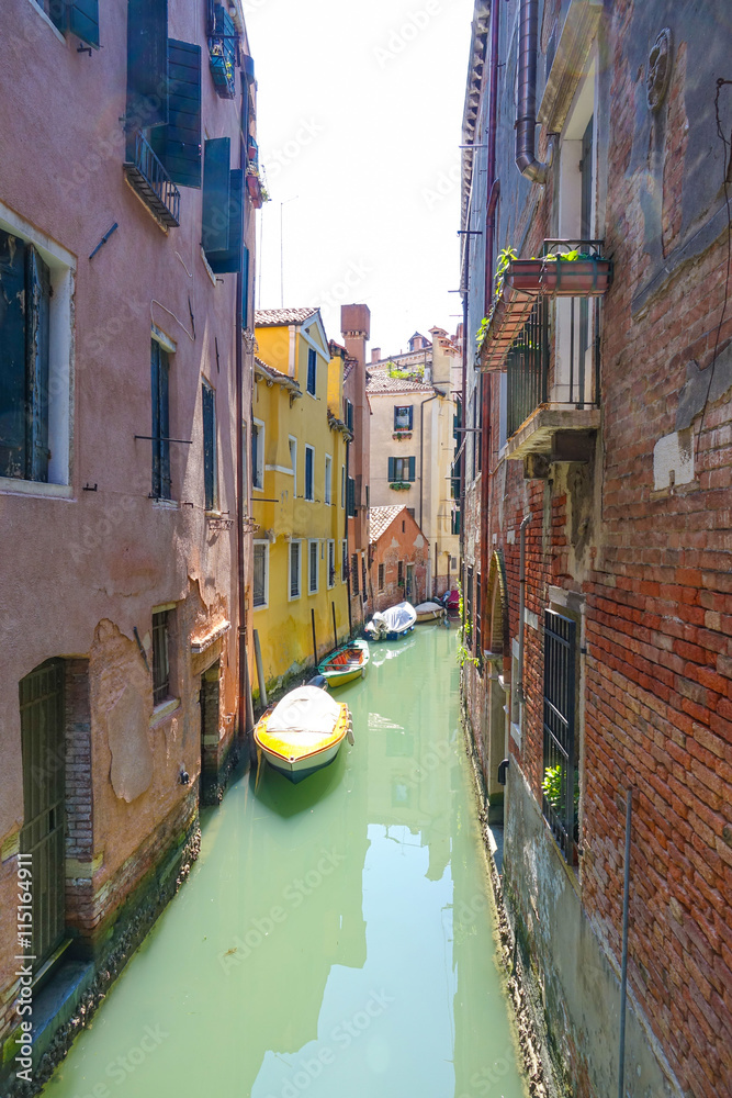 Small and narrow canals in Venice