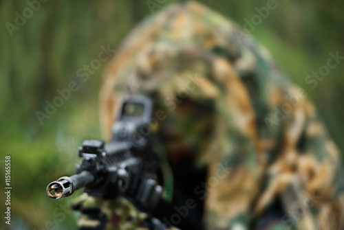 soldier carrying m-16