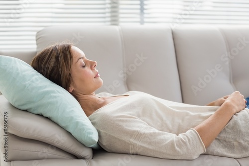 Woman sleeping on sofa © WavebreakMediaMicro