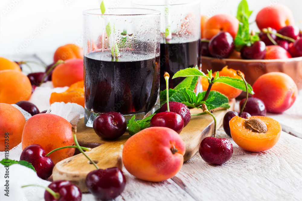 Ceramic bowl with organic ripe apricots and cherries Ceramic bowl with organic ripe apricots and cherries