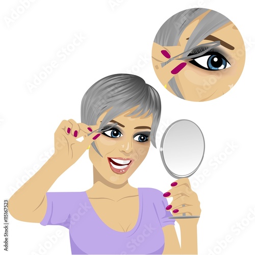 young woman plucking her eyebrows with tweezers looking at mirror