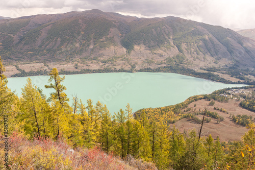 kanas lake in autumn with crystal blue water. Green trees. The natural beauty of the paradise. Kanas Nature Reserve. Xinjiang Province, China. photo