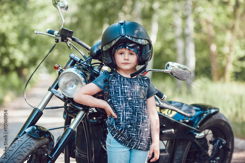 Little girl on a motorcycle.