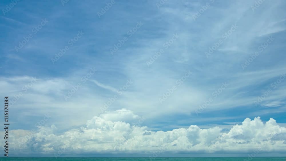Storm clouds building in the extreme distance, over a flat, glassy, tropical sea with a bold horizon line. Video 3840x2160 Storm clouds building in the extreme distance, over a flat, glassy, tropical sea with a bold horizon line. Video 3840x2160