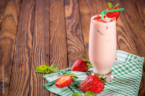 glass of smoothie, yogurt and fresh strawberries