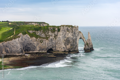 The beach and stone cliffs in Etretat, France