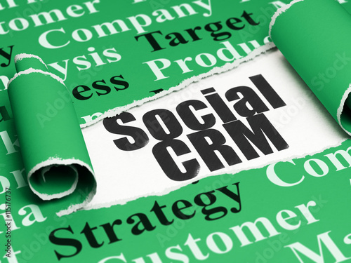 Marketing concept: black text Social CRM under the piece of  torn paper