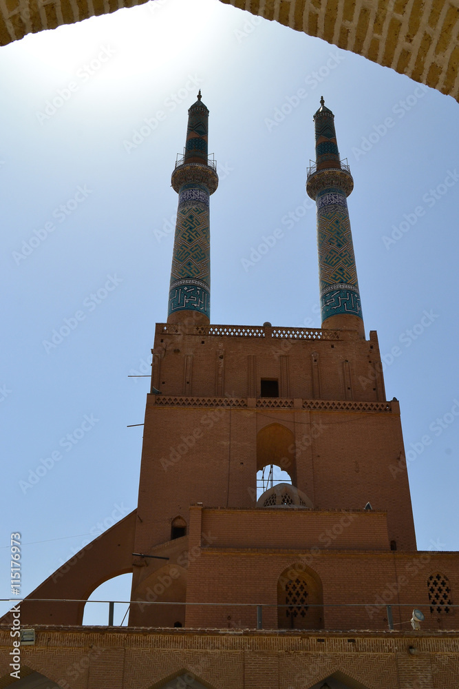Two minarets unfer the sun, Yazd, Iran