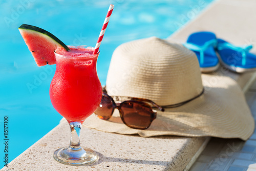 Watermelon fresh juice smoothie drink cocktail slippers, hat, sunglasses pool