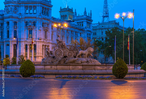 Night view of Cybele's Square (Plaza de la Cibeles) and Central Post Office (Palacio de Comunicaciones) in Madrid, Spain
