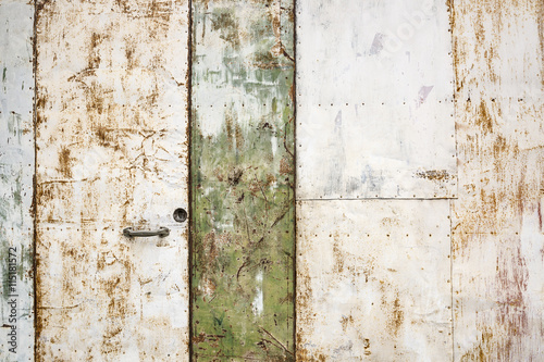 handle and lock of an ancient rusty metallic door