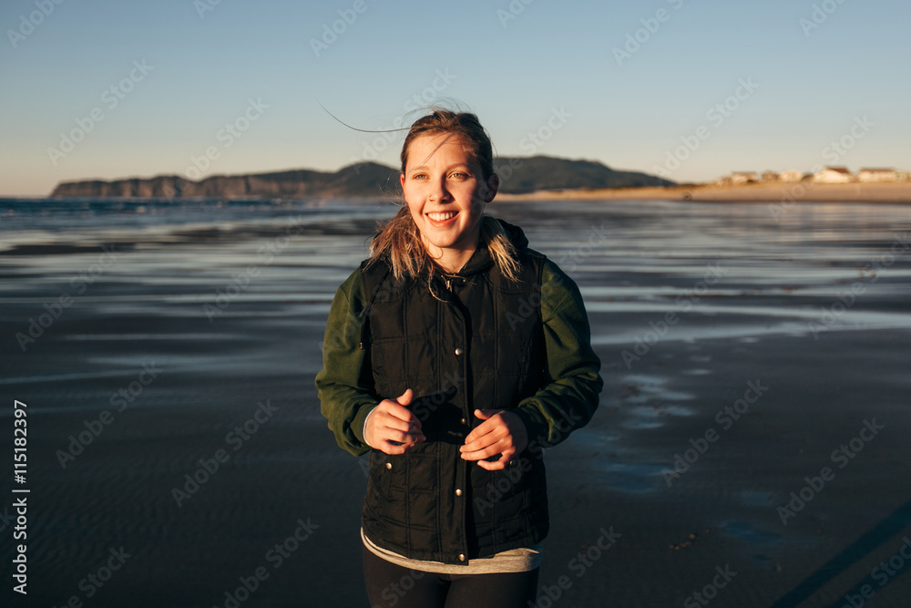 Female Runner on the Beach at Sunset Female Runner on the Beach at Sunset