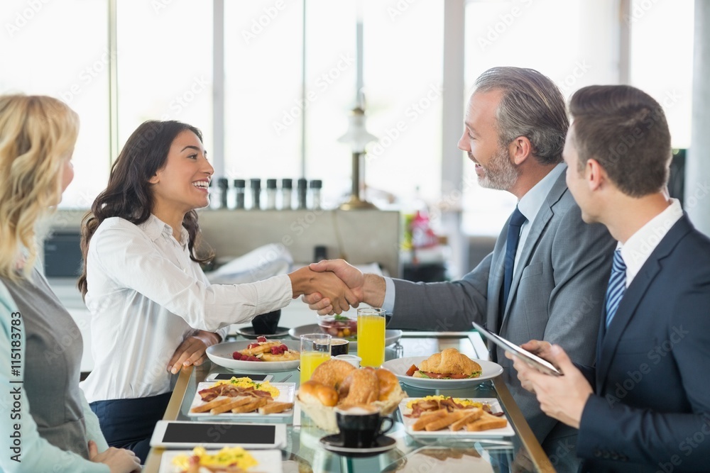 Businessmen shaking hands with each other Businessmen shaking hands with each other