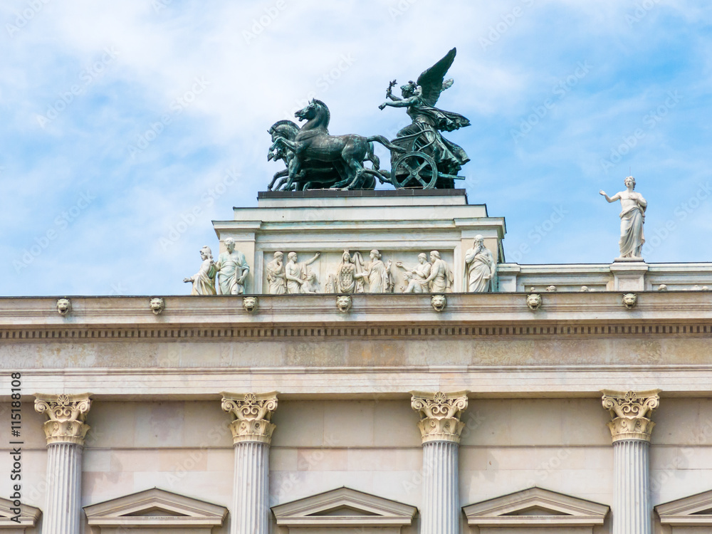 Top of front facade of Austrian parliament building with bronze quadriga, Ringstrasse in downtown Vienna, Austria