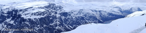 Panorama of snow-capped mountains and huts