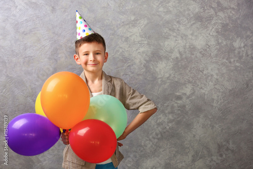 Boy with color balloons on ...