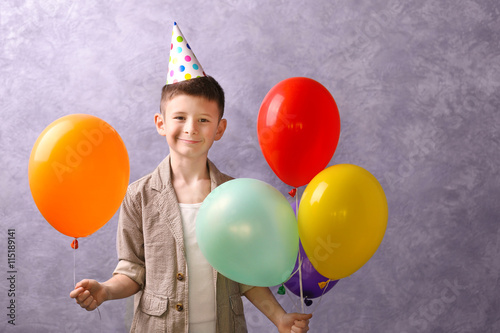 Boy with color balloons on ...