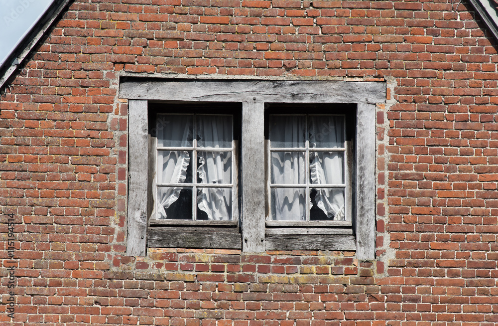 They say you can see soul of the house in it's windows..  Windows on the facade of old house in Pont-l'Eveque, Normandy, France