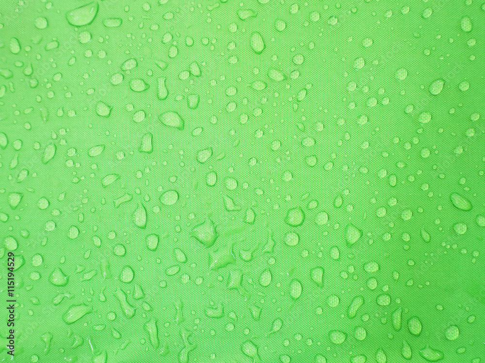 water drops on green waterproof fabric