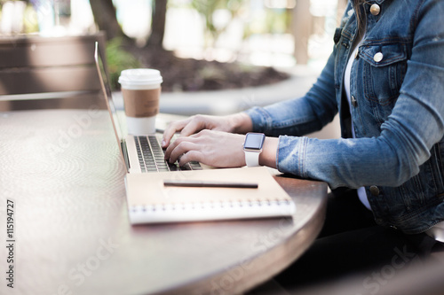 Typing on a laptop