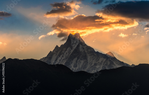 Nepal, Mount Machapuchare (Fishtail) at sunrise, view from poon hill Nepal. Machapuchare is a mountain in the Annapurna Himal of north Central Nepal. photo
