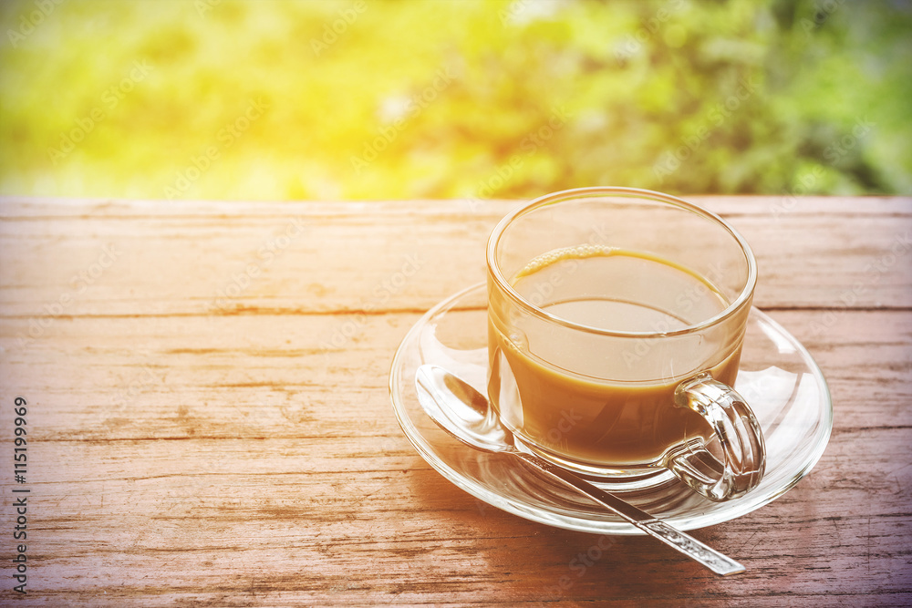 In the morning, black coffee on the wooden floor. In the morning, black coffee on the wooden floor.