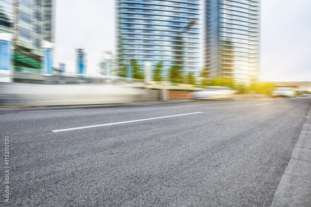 Fototapeta premium motion blurred car with modern buildings background