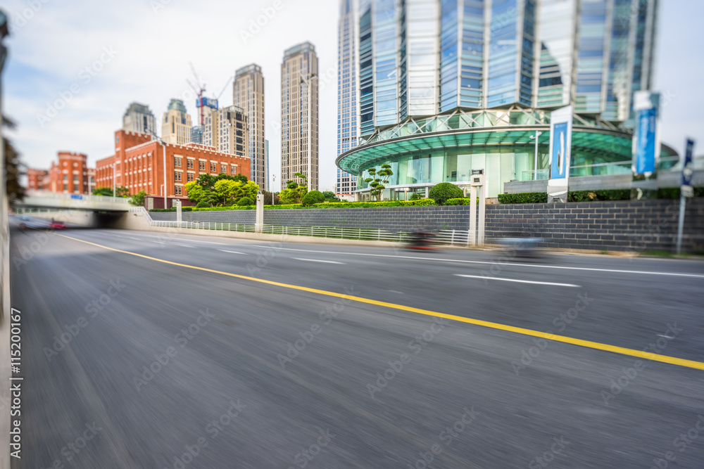 motion blurred car with modern buildings background
