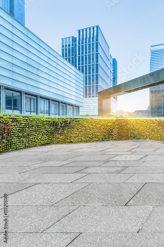 empty pavement and modern buildings in city