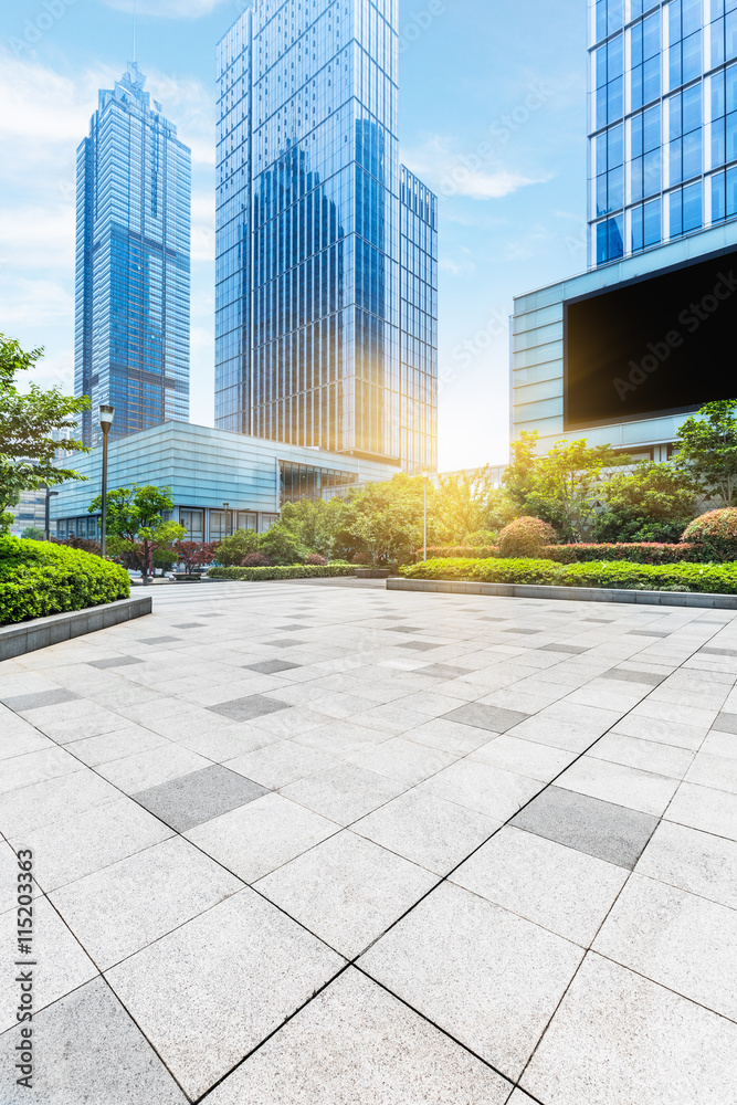 empty pavement and modern buildings in city