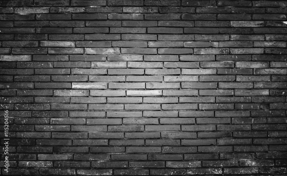 Old and dirty brick wall black background, texture.