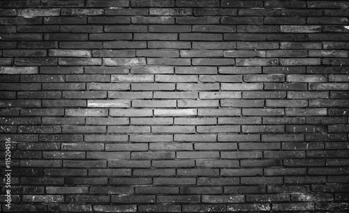 Old and dirty brick wall black background, texture.