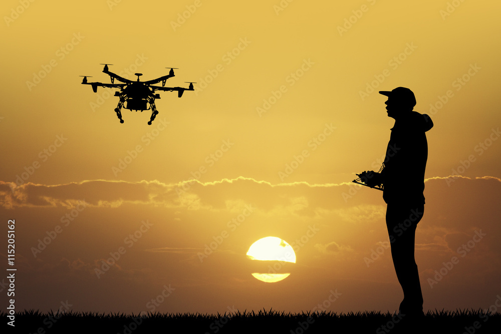 man with drone - obrazy, fototapety, plakaty 