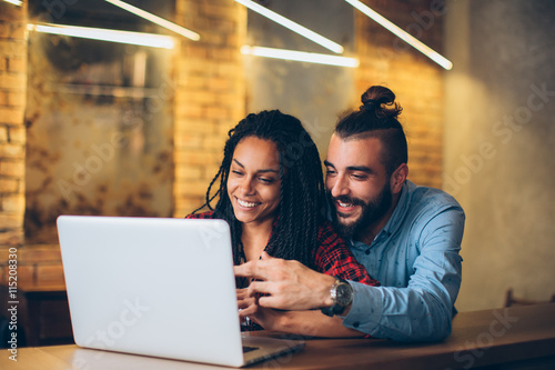 Couple looking at laptop