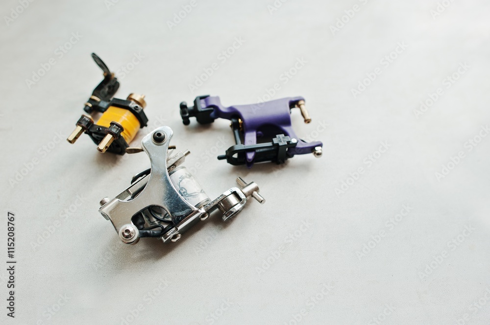 Set of different machines for tattoo at white background