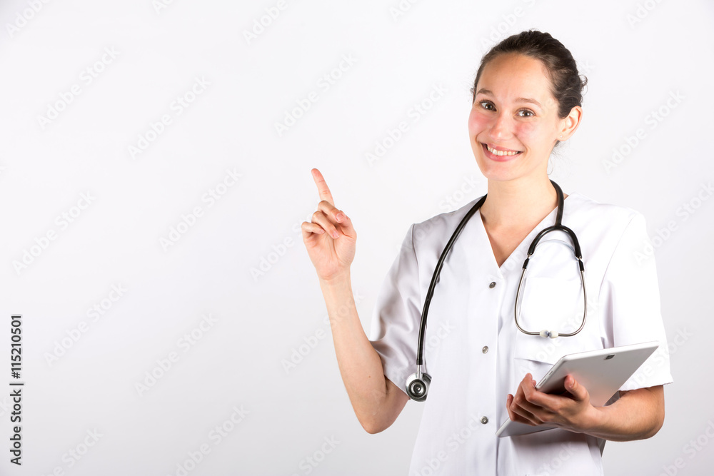 Smiling medical doctor woman with stethoscope on a white backgro Smiling medical doctor woman with stethoscope on a white backgro