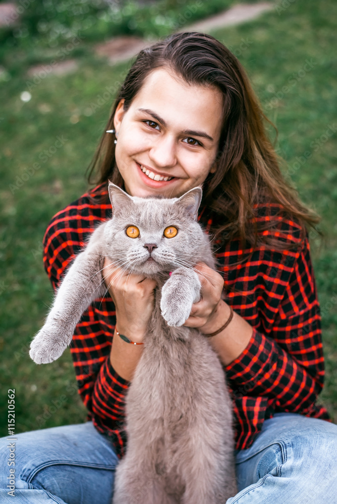 girl playing with her cat