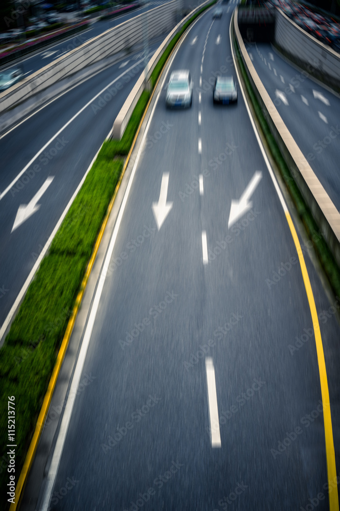 blurred car speeding on highway