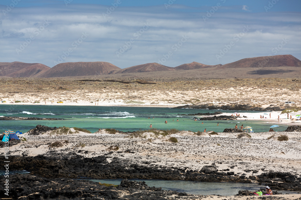 Beach near the lighthouse El Toston, northern part of Fuerteventura . Canary Island, spain Beach near the lighthouse El Toston, northern part of Fuerteventura . Canary Island, spain
