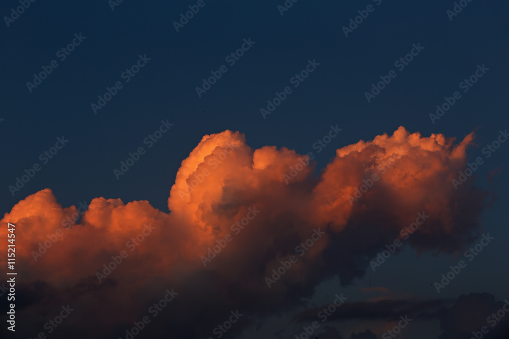 Naklejka premium Clouds in the evening sky illuminated by the sun has sat down fo