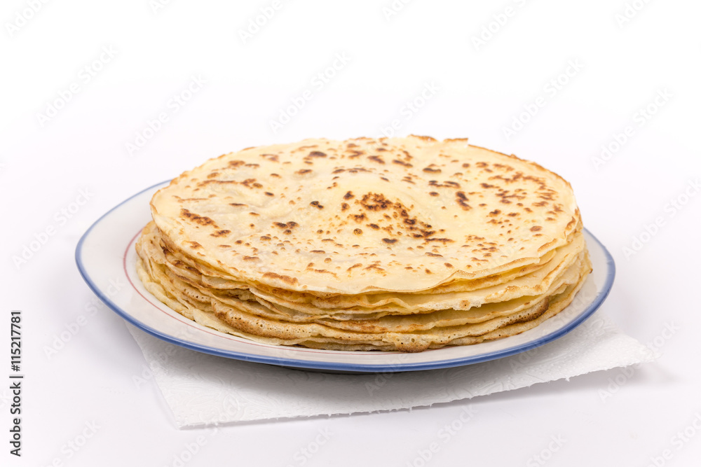 Homemade pancakes on the plate. Isolated on white background.