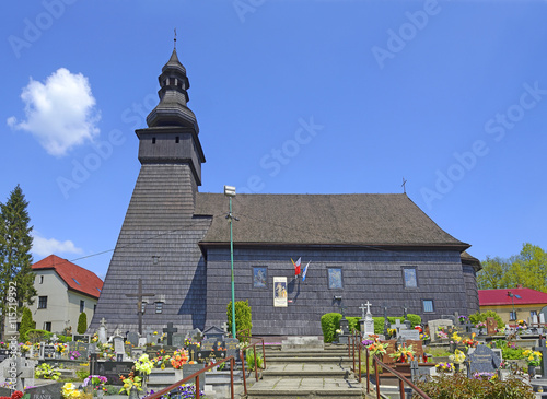 Wooden church with cemetery in Konczyce Wielke village in Silesia. Church belongs to a set of exquisite wooden churches Cieszyn Silesia, Poland photo